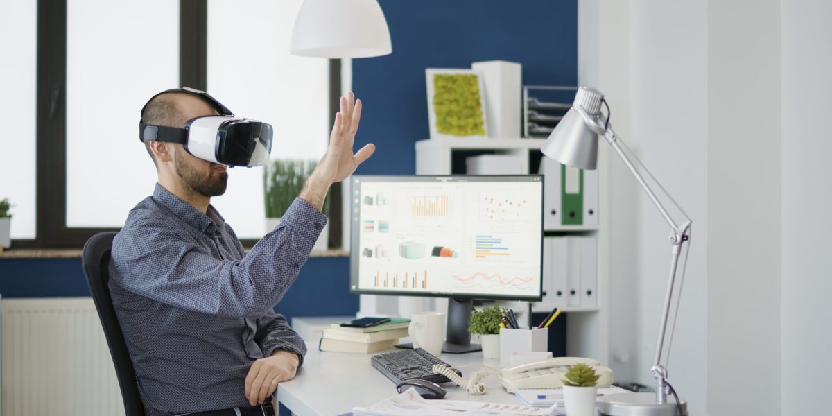 Business man working with vr glasses in company office, using virtual reality goggles with 3d interactive vision. Executive manager planning charts statistics for financial development.